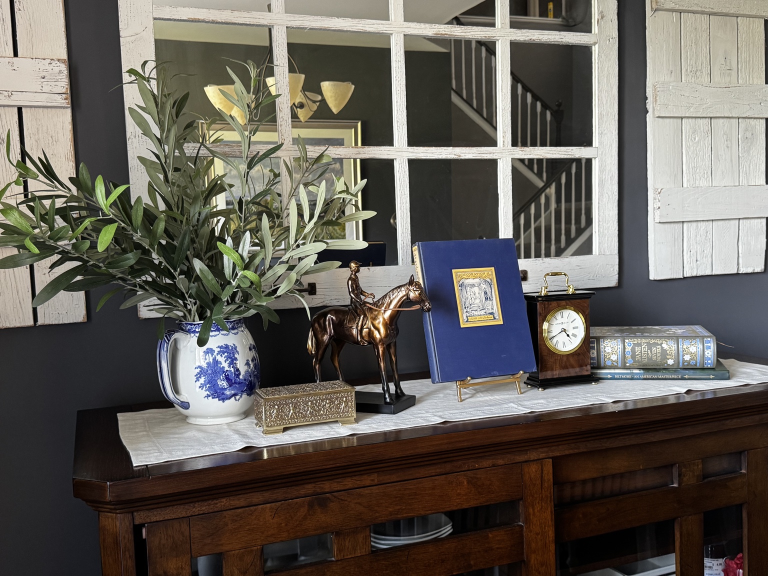 Collected objects styled on a dining room sideboard