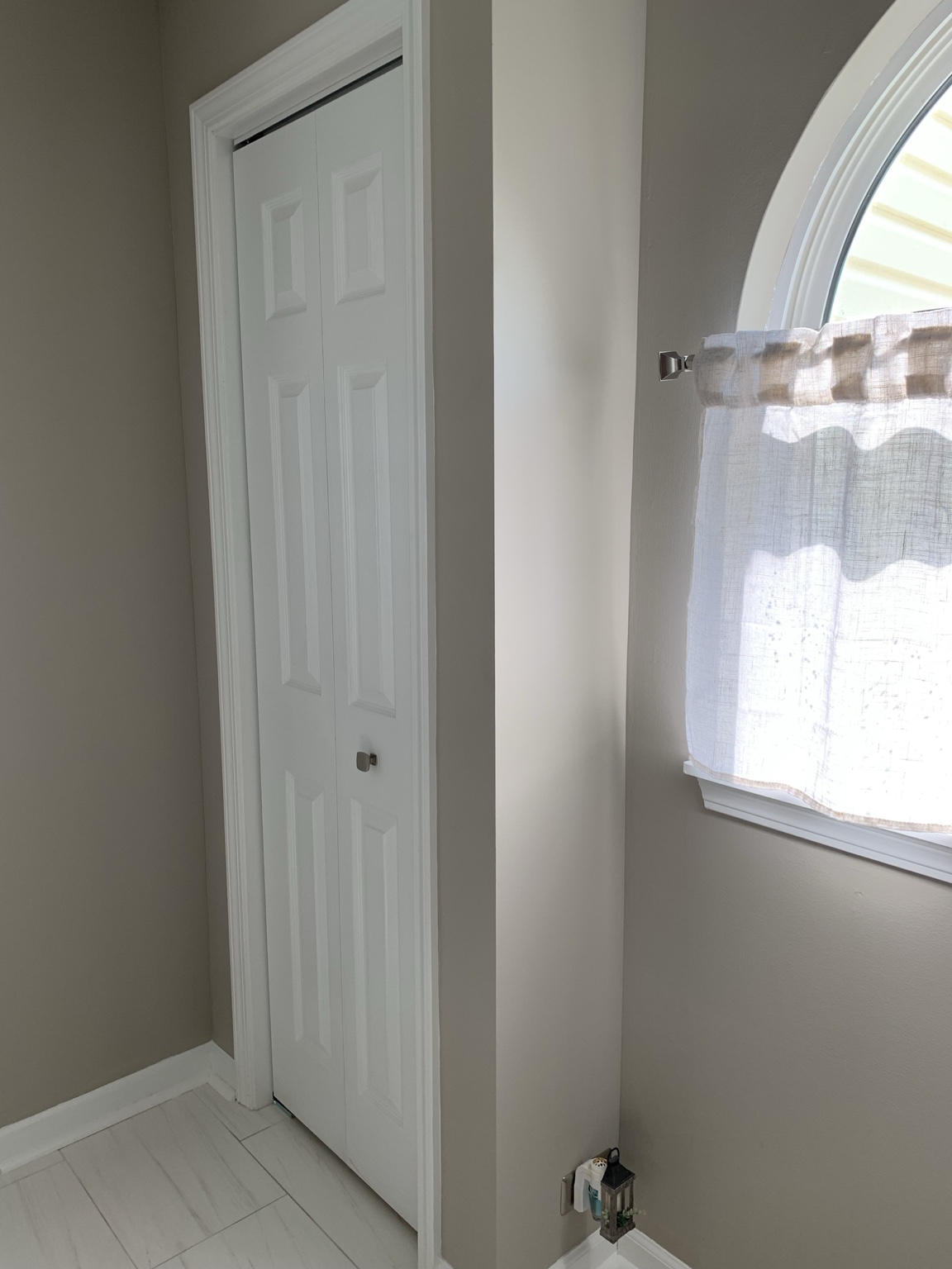 New linen closet built in the space previously occupied by the original shower.